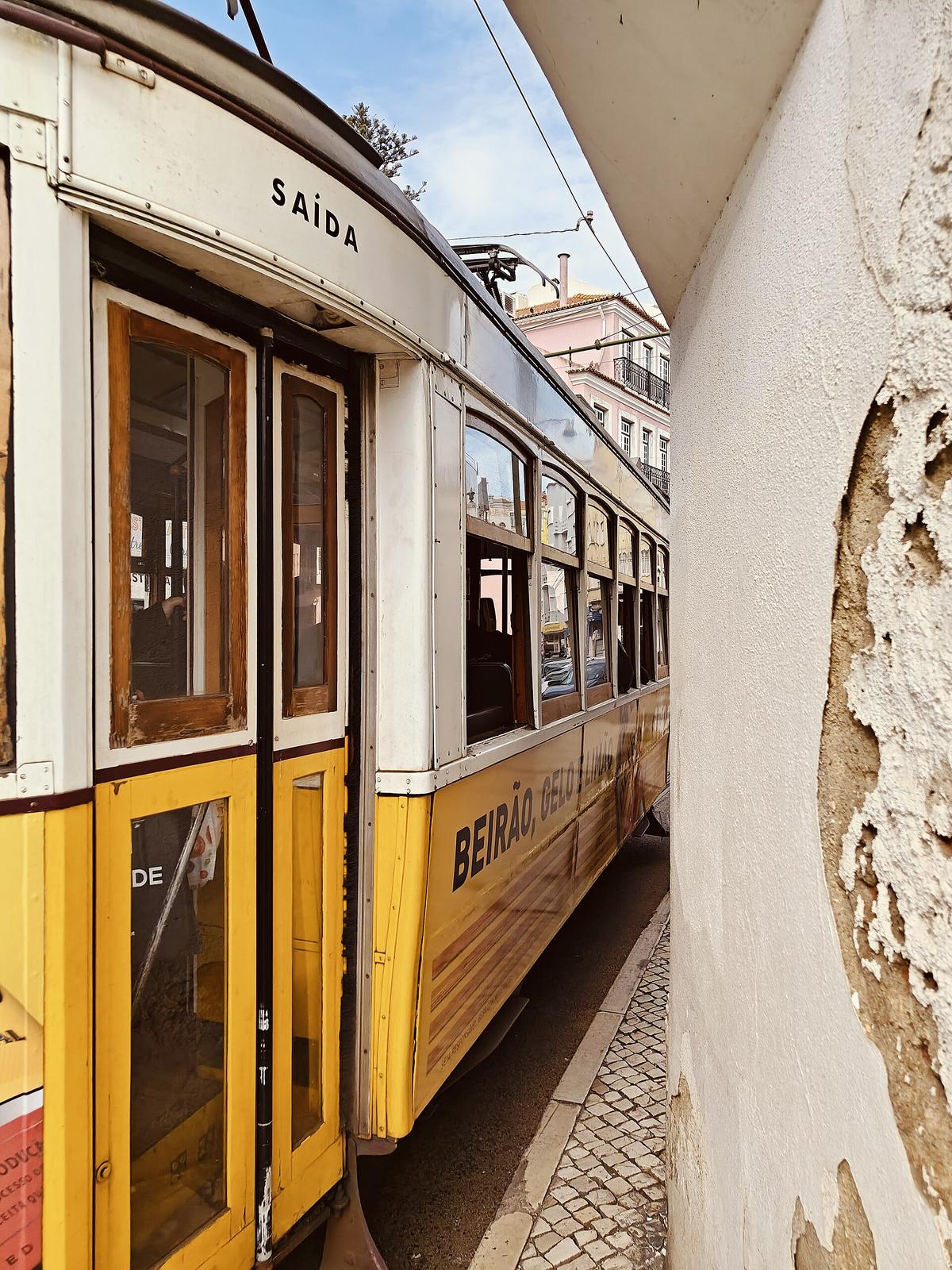 Lisbon tram narrow street night