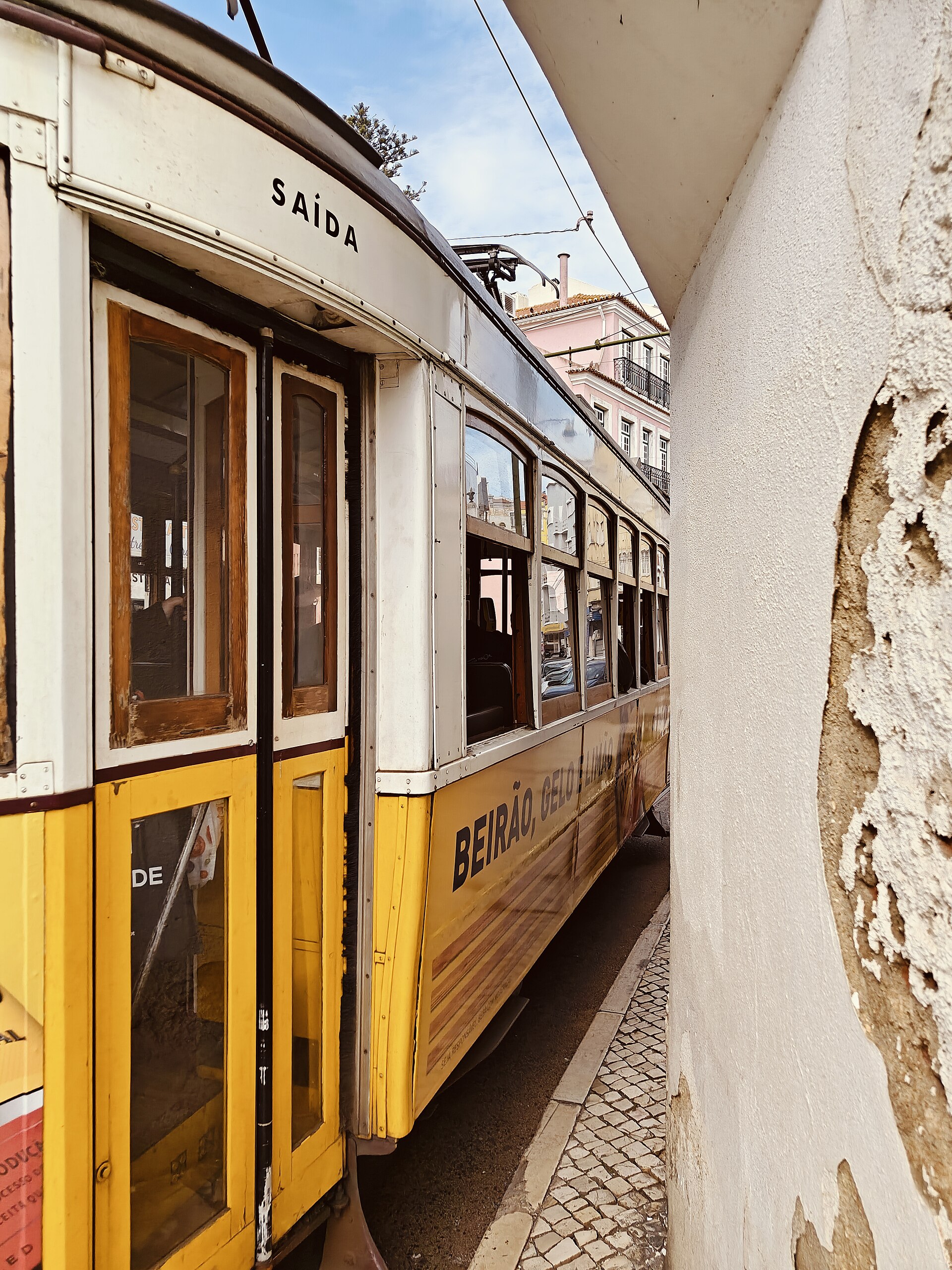 Lisbon tram narrow street night